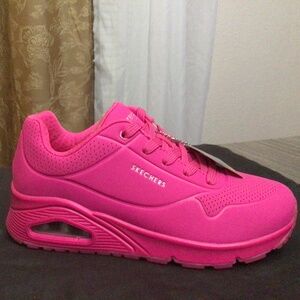 Neon pink Skechers
